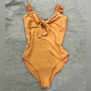 Orange bodysuit